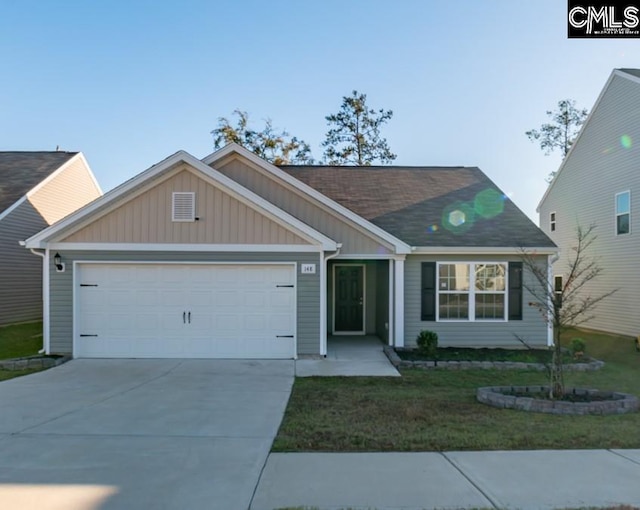 view of front facade with a garage and a front lawn