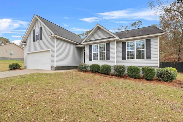 view of front of property with a garage and a front yard