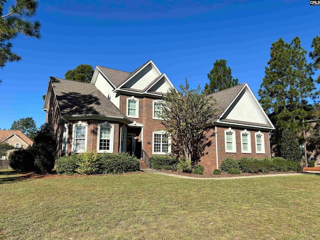 view of property featuring a front yard