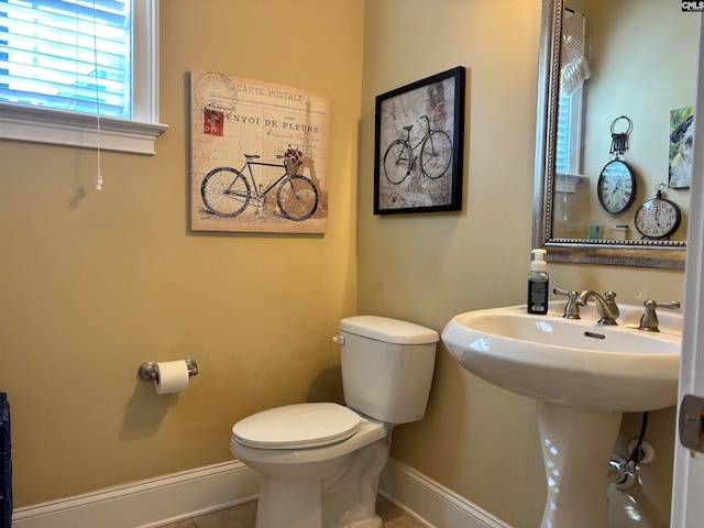 bathroom featuring tile patterned floors and toilet