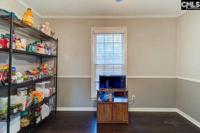 home office featuring ornamental molding and dark wood-type flooring