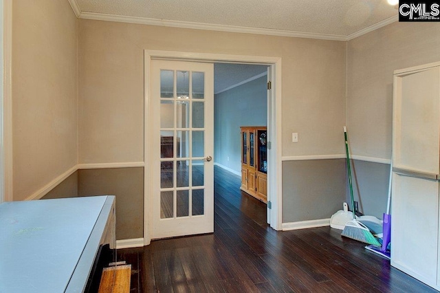 miscellaneous room featuring dark hardwood / wood-style floors, ornamental molding, and a textured ceiling