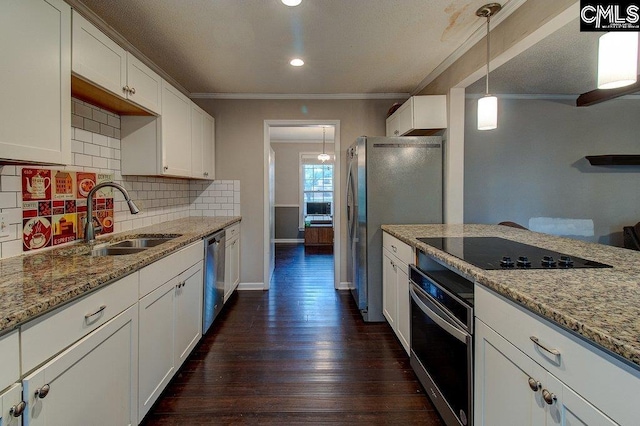 kitchen featuring dark hardwood / wood-style flooring, sink, white cabinets, and appliances with stainless steel finishes