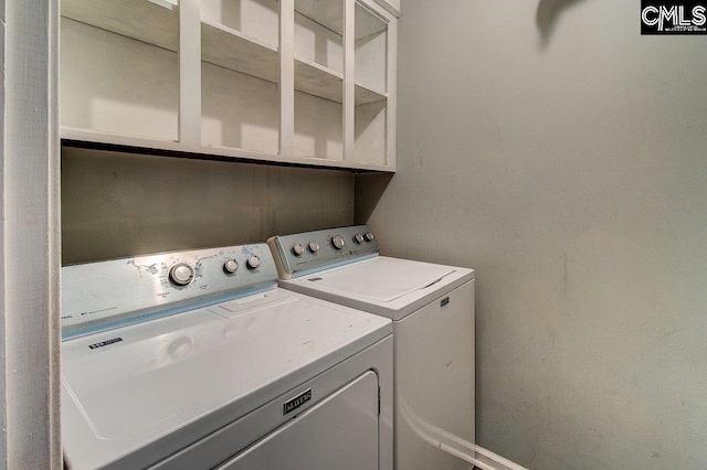 laundry room featuring washer and clothes dryer