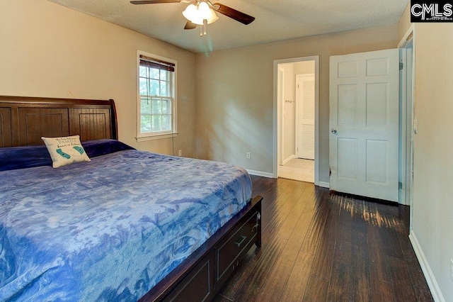 bedroom featuring dark hardwood / wood-style floors and ceiling fan