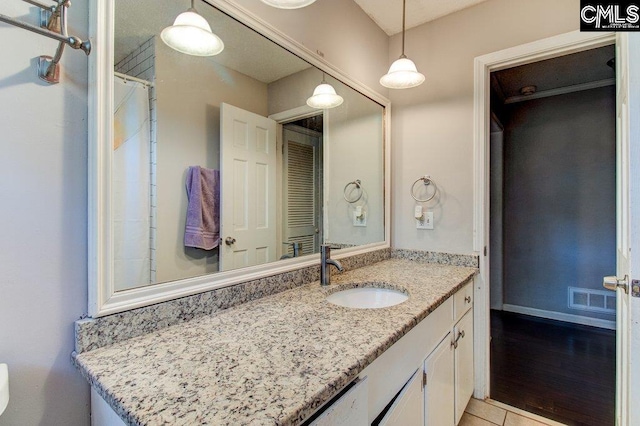 bathroom featuring hardwood / wood-style floors and vanity