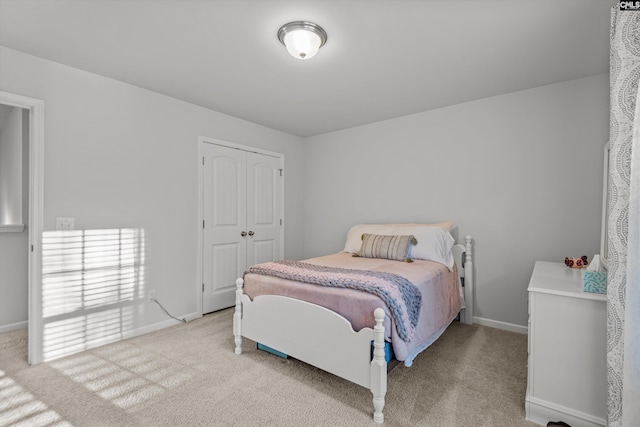 carpeted bedroom featuring a closet