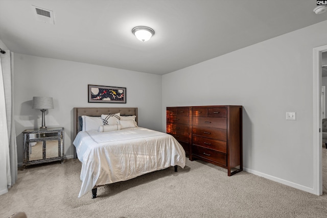 bedroom with light carpet