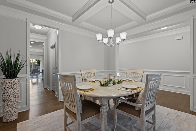 dining room with coffered ceiling, an inviting chandelier, crown molding, hardwood / wood-style flooring, and beamed ceiling