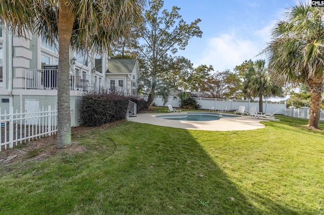 view of yard with a fenced in pool and a patio area