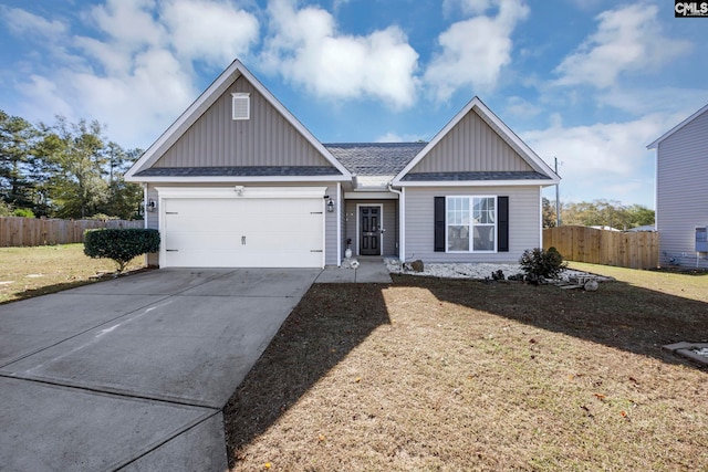 view of front of home with a front lawn and a garage