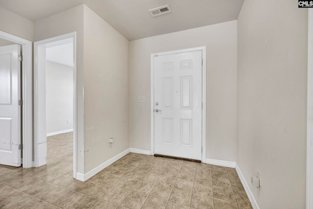 entryway with light tile patterned floors