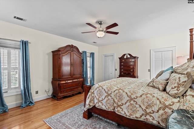 bedroom with light wood-type flooring and ceiling fan