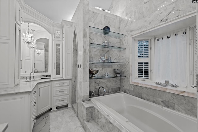 bathroom with vanity and a relaxing tiled tub