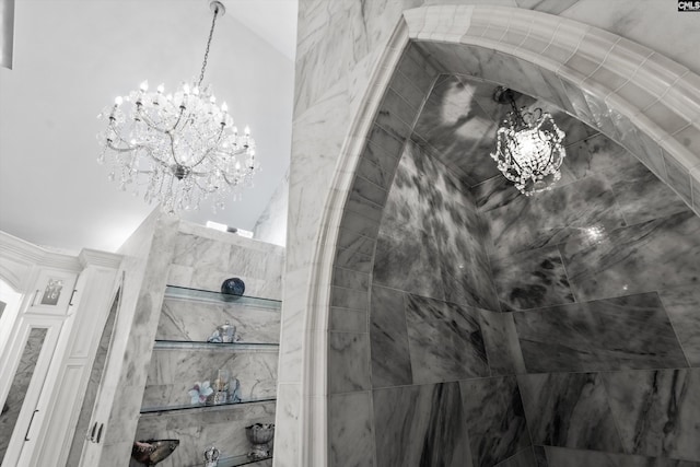 bathroom featuring an inviting chandelier