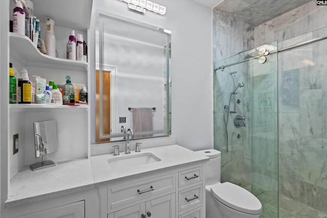 bathroom featuring toilet, vanity, and walk in shower