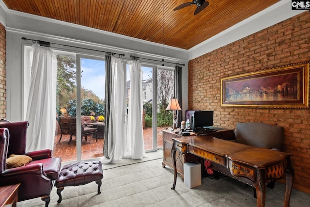 home office featuring wooden ceiling, crown molding, ceiling fan, and brick wall