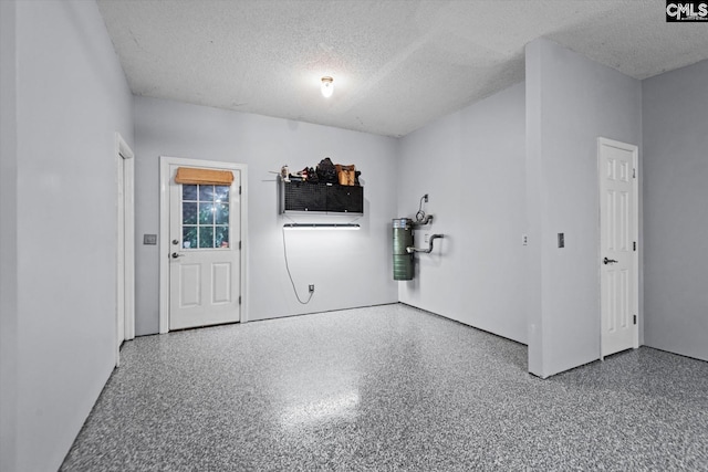 empty room featuring a textured ceiling