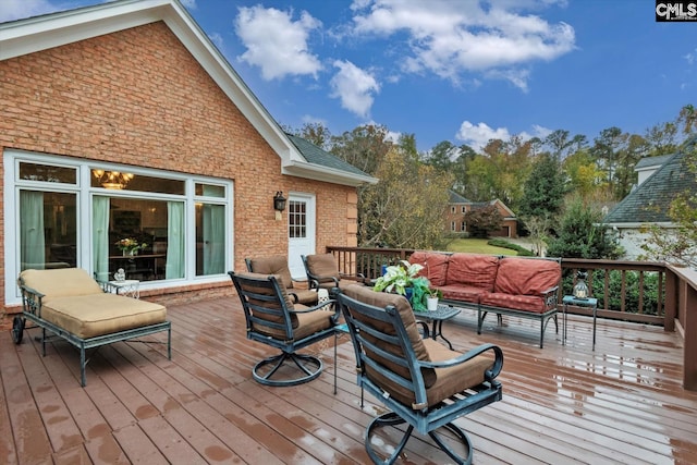 wooden deck featuring an outdoor living space