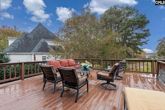 deck featuring outdoor lounge area