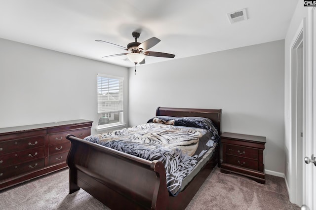 bedroom featuring ceiling fan and light carpet