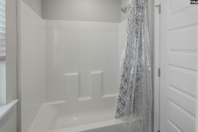 bathroom featuring shower / bath combination with curtain