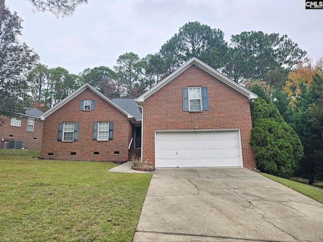 front of property featuring central AC unit, a front yard, and a garage