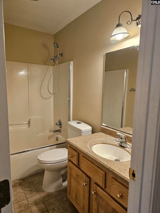 full bathroom with tile patterned floors, vanity, toilet, and washtub / shower combination