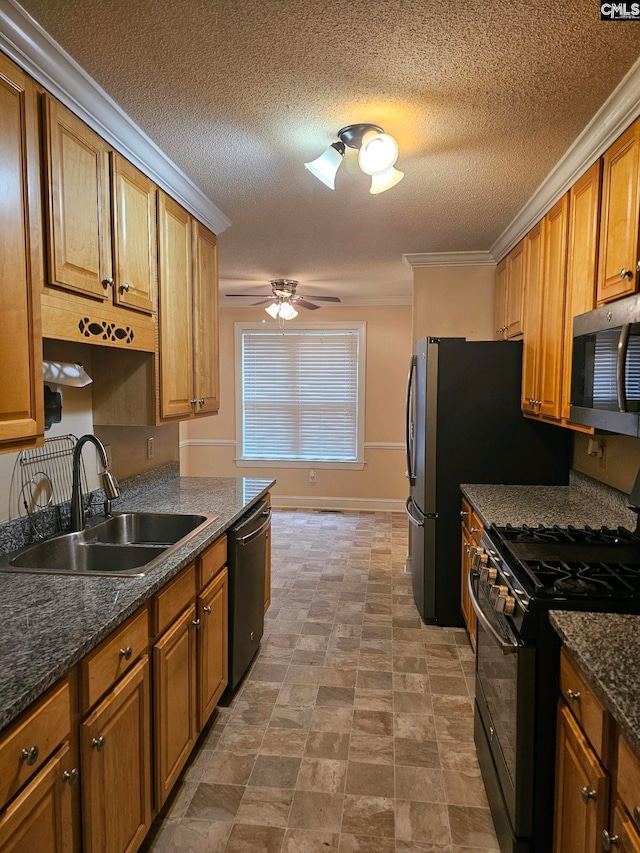 kitchen featuring sink, ceiling fan, ornamental molding, a textured ceiling, and appliances with stainless steel finishes