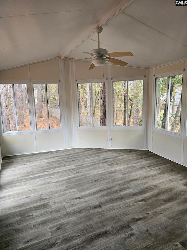 unfurnished sunroom featuring vaulted ceiling with beams, a healthy amount of sunlight, and ceiling fan