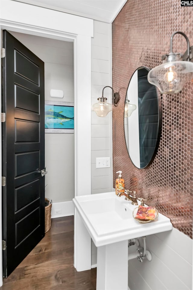 bathroom with hardwood / wood-style floors