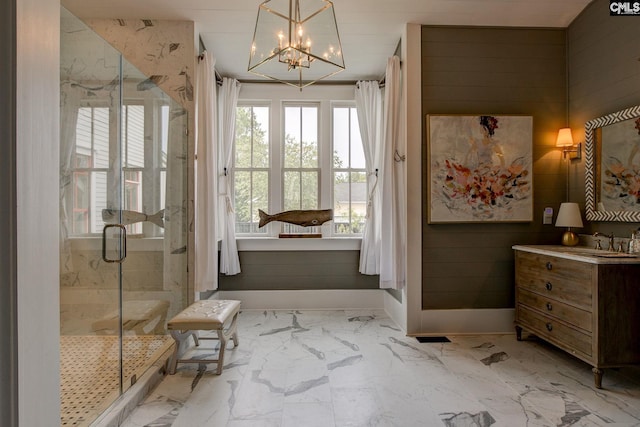 bathroom featuring vanity, an inviting chandelier, and walk in shower