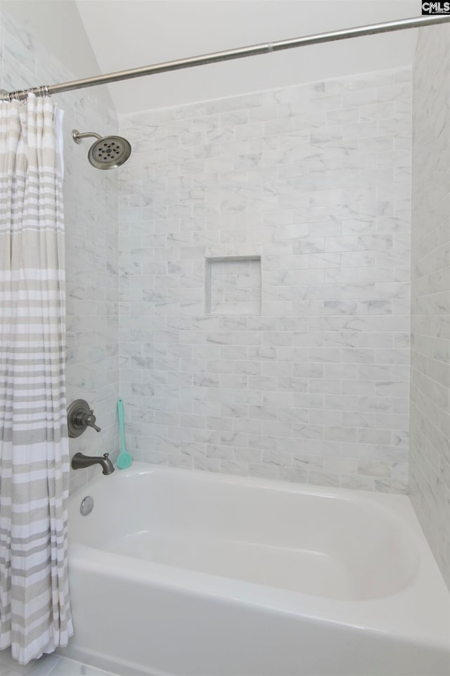 bathroom featuring shower / bathtub combination with curtain