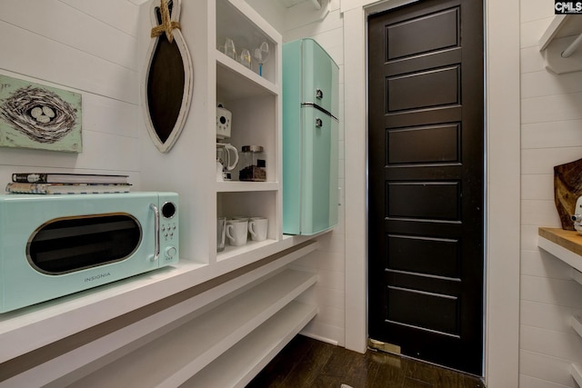 laundry room featuring dark hardwood / wood-style flooring