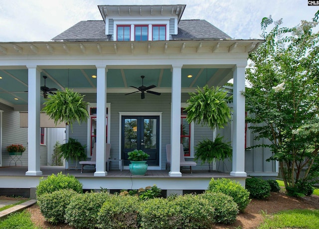 entrance to property with ceiling fan and covered porch