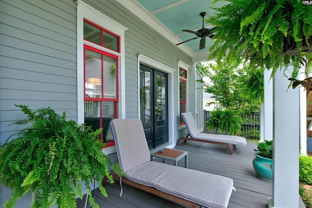 wooden deck featuring ceiling fan