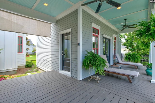 wooden terrace featuring ceiling fan and covered porch