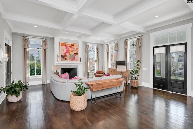 living room with beamed ceiling, dark hardwood / wood-style flooring, coffered ceiling, and french doors