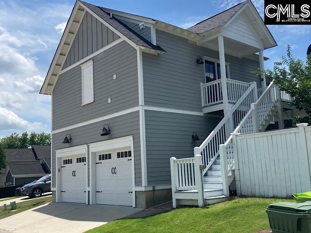 exterior space with a yard and a garage