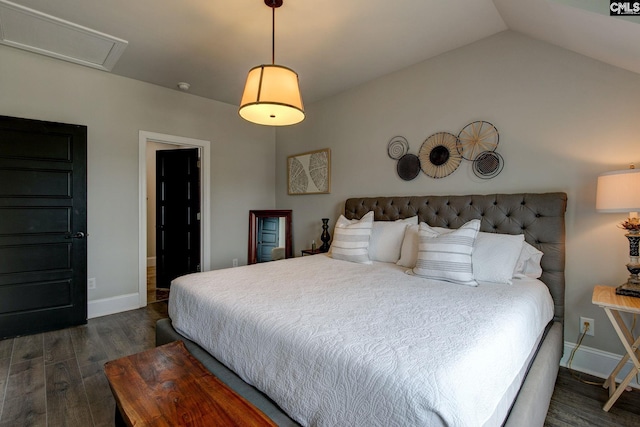 bedroom featuring dark hardwood / wood-style floors and lofted ceiling