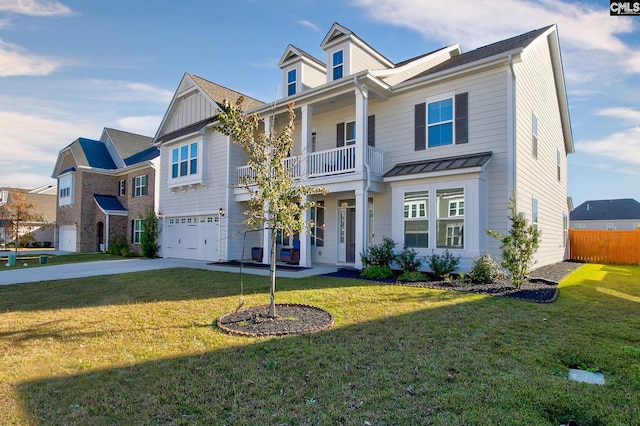 view of front of property with a front yard, a balcony, and a garage