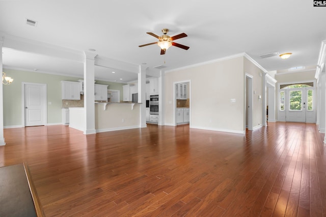 unfurnished living room with wood-type flooring, ceiling fan with notable chandelier, and crown molding