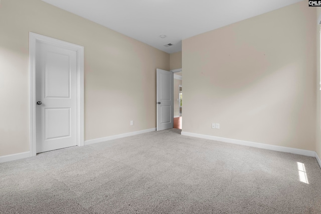 empty room featuring carpet floors