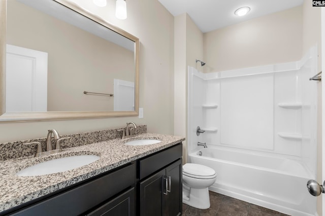 full bathroom featuring tile patterned flooring, shower / washtub combination, vanity, and toilet