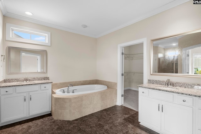 bathroom featuring vanity, tiled bath, a wealth of natural light, and crown molding