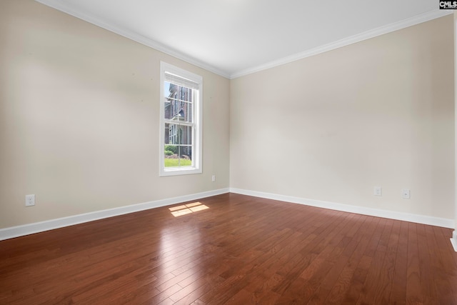 unfurnished room featuring dark hardwood / wood-style floors and crown molding