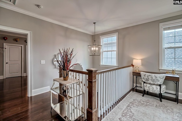 interior space with crown molding, dark hardwood / wood-style flooring, and a chandelier