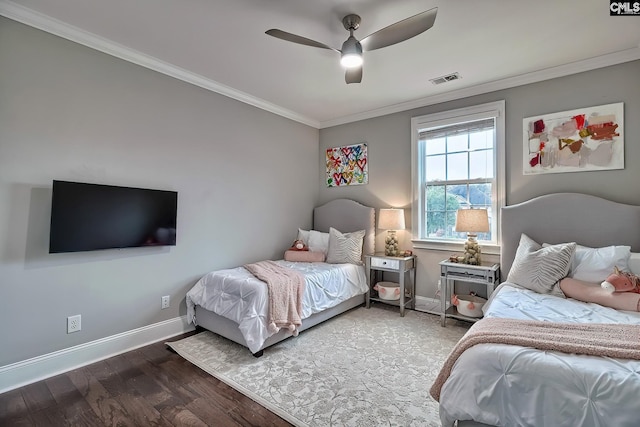 bedroom with hardwood / wood-style flooring, ceiling fan, and crown molding