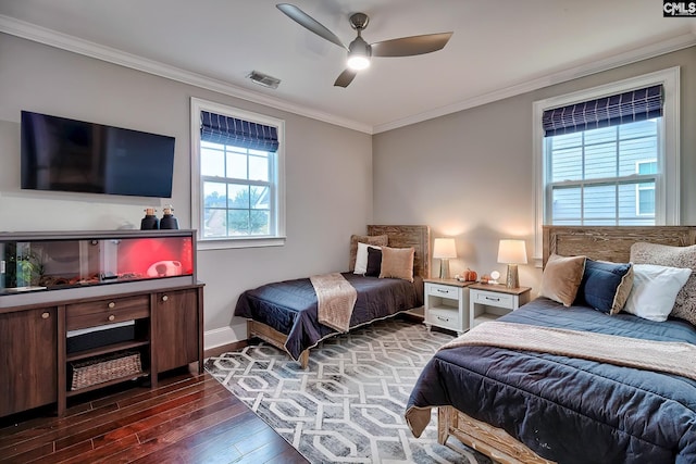 bedroom with ceiling fan, dark hardwood / wood-style floors, and ornamental molding