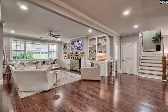 living room with ceiling fan, crown molding, and dark wood-type flooring